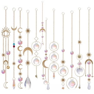 Macro detail of bohemian crystal suncatchers with moon and star metal ornaments