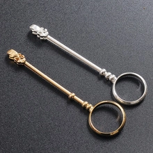 Detail of rose-shaped gold and silver cigarette holder rings for hands-free gaming