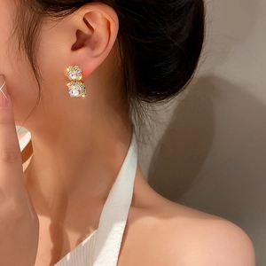 Luxurious gold drop earrings with double square white zircons and shimmering accents
