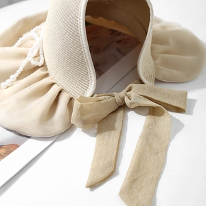 French retro beige straw sun hat with large cream satin bow and pleated wavy brim