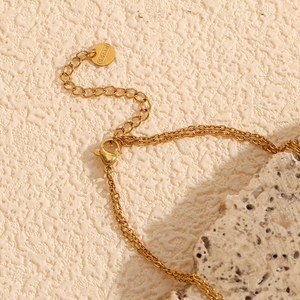 Detail of 18K gold plated stainless steel necklace with lobster clasp and S.Steel tag