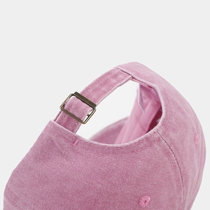 Pink washed cotton baseball cap featuring adjustable bronze buckle and neat stitching details