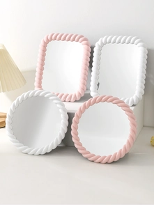 Detail of round and rectangular makeup mirrors with stylish twisted rope frame design