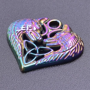 Macro shot of a heart-shaped wolf pendant with rainbow iridescent finish and Celtic knot