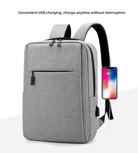 Detail of grey laptop backpack with external USB port charging a smartphone
