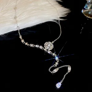 Elegant silver camellia flower necklace with sparkling rhinestones and waterdrop pendant