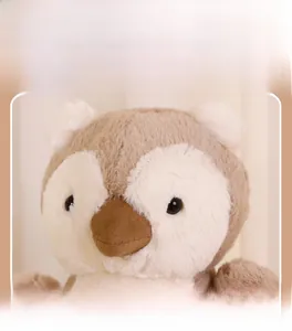 Close-up of soft plush toy featuring detailed electric embroidery and premium plush texture