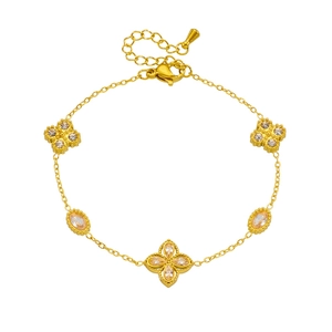 Elegant 18K gold clover bracelet featuring zircon inlay and a delicate link chain