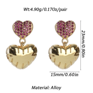Detailed view of gold alloy heart earrings with magenta stones showing 23mm size dimensions