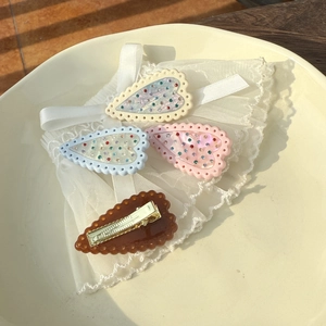 Set of five heart-shaped hair clips with lace borders and sparkling diamond accents