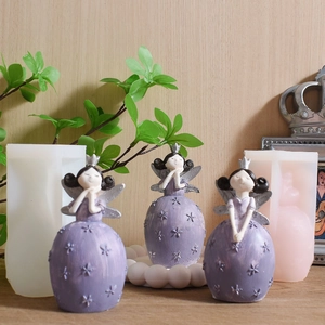 Detailed silicone mold and finished purple angel girl figurines with star relief
