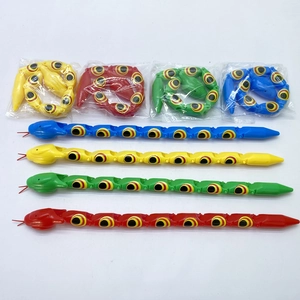Detailed view of colorful articulated plastic toy snakes in coiled and flat positions