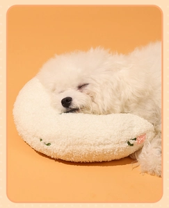 U-shaped white plush pet pillow with flower embroidery for cat neck support and sleep