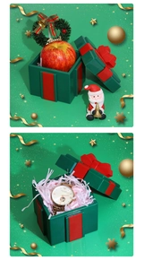 Detailed view of festive Christmas gift boxes with ribbons for apples and watches