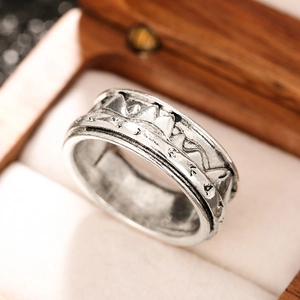 Retro silver mountain range relief ring with vintage textured finish for index finger