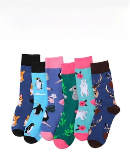 Detail showing six pairs of crew socks with colorful animal prints like corgis and penguins