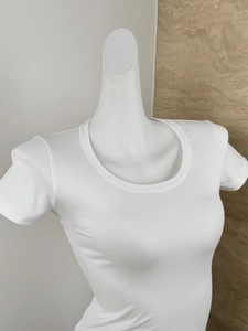 Detail shot of white ribbed U-neck short sleeve tee showing the fabric texture and neckline