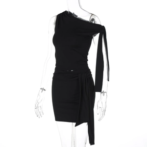Detail view of black one-shoulder slim dress with ruching and decorative ribbon