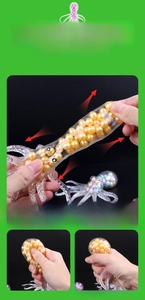 Detail view of octopus sensory toy showing stretchable TPR material and interior golden beads