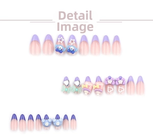 Detail of 3D bear and bow charms on purple and blue cartoon style press-on nails