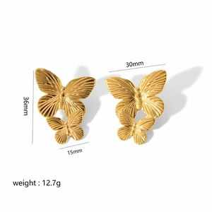Detailed dimensions of gold butterfly earrings with 36mm height and 12.7g weight