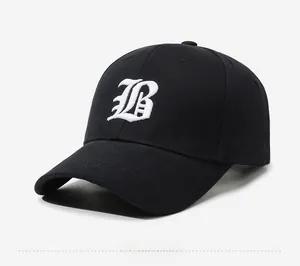 Close-up of gothic B letter embroidery and Boston text on black cotton baseball cap