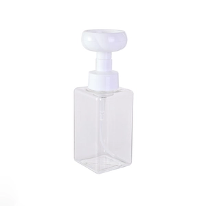 Clear square foaming bottle with a white flower-shaped pump head for facial cleansers