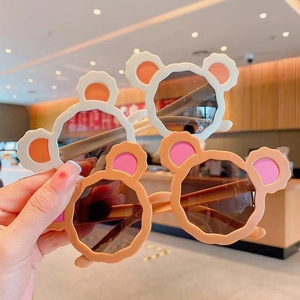 Cute cartoon bear ear sunglasses for kids with stylish UV protection dark lenses.