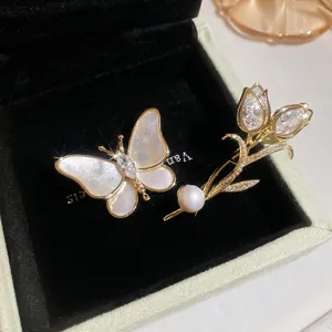 Elegant butterfly brooch and tulip ring set with mother of pearl and zircons