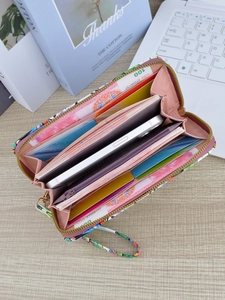 Long zipper wallet with colorful patterns and pink leather interior for phone and cards