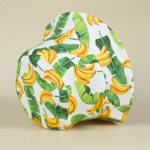 Detail of white cotton bucket hat featuring bright yellow banana and green leaf prints