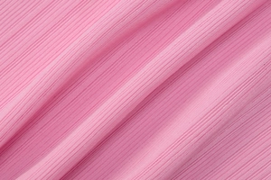 Dettaglio ravvicinato del tessuto a maglia a coste rosa con trama morbida ed elastica