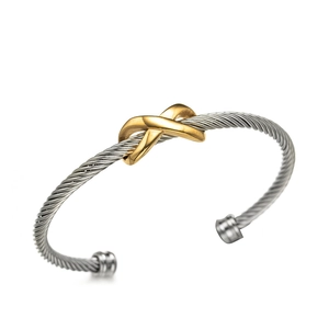 Minimalist twisted wire C-shape stainless steel bangle with gold X-shaped accents