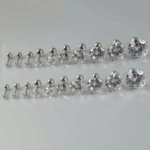 Macro shot of stainless steel cartilage studs with round cubic zirconia in various sizes