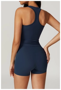 Deep blue racerback sports vest and shorts set showing seamless stitching and fabric detail