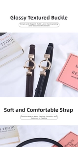 Detail of round golden metal buckle and soft leather texture on a slim women's waist belt