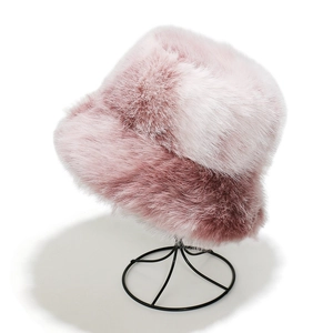 Detailed macro view of soft pink and white gradient faux fur texture on a winter bucket hat
