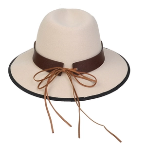 Detail of cream felt hat featuring a dark brown ribbon band and delicate leather bow