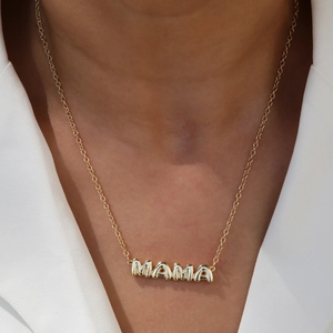 Chic 18k gold plated MAMA letter pendant necklace on a model wearing white