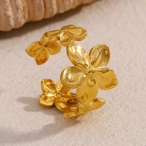 Detailed macro shot of 18K gold plated flower open ring with intricate floral patterns