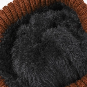Thick brown knitted beanie for winter with soft black faux fur lining for extra warmth
