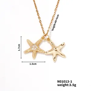 Detail of 18K gold starfishes pendant necklace with white zircon pavé and adjustable chain