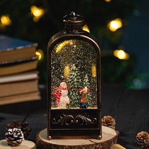 Vintage bronze Christmas snow globe lantern with snowman miniature and warm LED light
