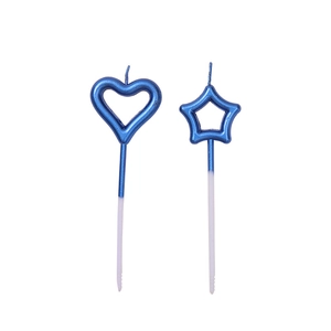 Pair of blue star and heart-shaped birthday candles on sticks for cake decoration