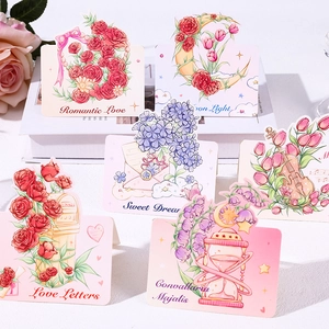 Detailed view of floral watercolor gift tags with romantic themes and paper textures