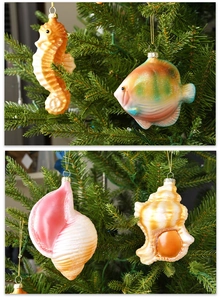 Close-up of colorful sea creature ornaments like seahorses on a Christmas tree