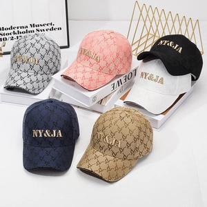 Fashionable baseball caps with all-over logo pattern and metallic NY&JA embroidery