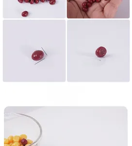 Close-up of 0.5cm-0.8cm mini chestnut-shaped wax beads in red and yellow colors