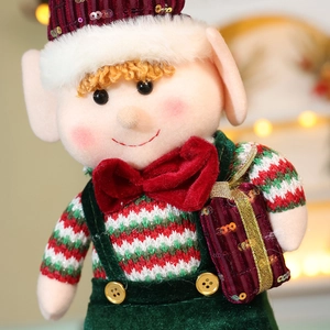 Standing Christmas elf doll ornament in classic red and green plush with sequins
