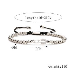 Detail of beaded bracelet with cubic zirconia paperclip charm and size annotations
